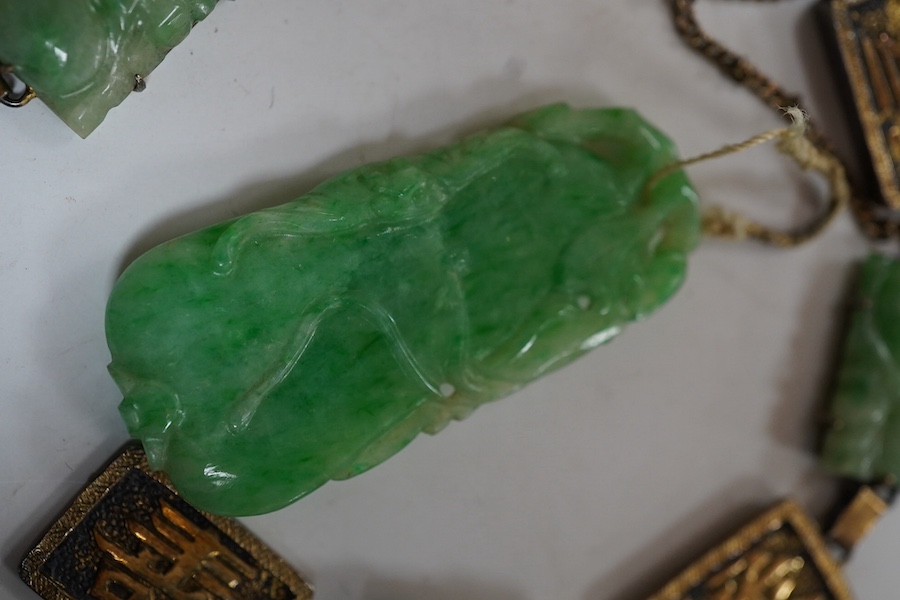 A Chinese gilt white metal and carved jade panel set bracelet, a.f, 17.5cm, together with a carved jade pendant, 40mm. Condition - poor to fair